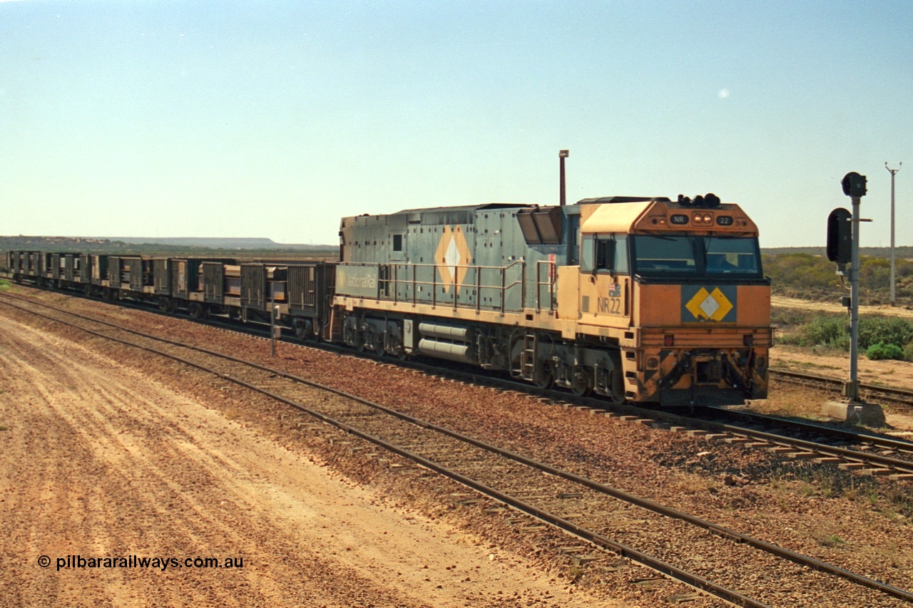 244-12
Port Augusta, Spencer Junction NR class NR 22 leads an UP short four waggon steel train off the Whyalla line. NR 22 is a Goninan built GE model Cv40-9i serial 7250-04/97-224.
