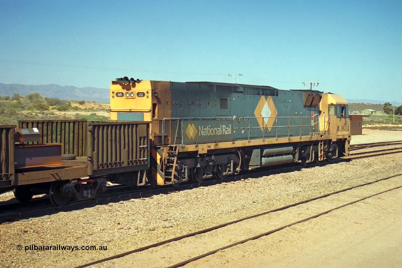 244-13
Port Augusta, Spencer Junction NR class NR 22 leads an UP short four waggon steel train off the Whyalla line. NR 22 is a Goninan built GE model Cv40-9i serial 7250-04/97-224.
