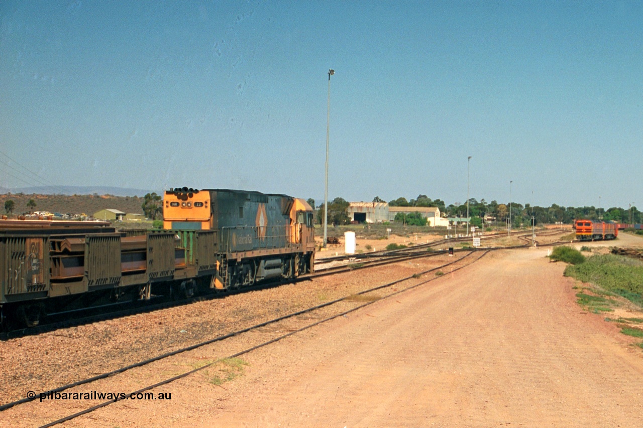 244-14
Port Augusta, Spencer Junction NR class NR 22 leads an UP short four waggon steel train off the Whyalla line. NR 22 is a Goninan built GE model Cv40-9i serial 7250-04/97-224.
