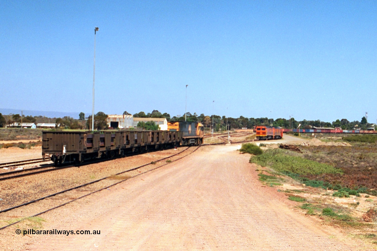 244-15
Port Augusta, Spencer Junction NR class NR 22 leads an UP short four waggon steel train off the Whyalla line. NR 22 is a Goninan built GE model Cv40-9i serial 7250-04/97-224.
