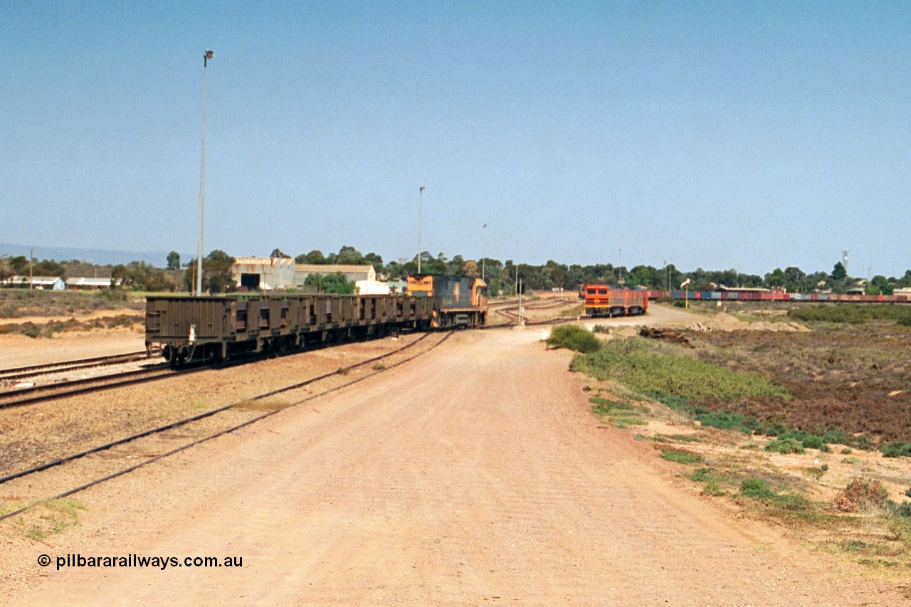 244-16
Port Augusta, Spencer Junction NR class NR 22 leads an UP short four waggon steel train off the Whyalla line. NR 22 is a Goninan built GE model Cv40-9i serial 7250-04/97-224.
