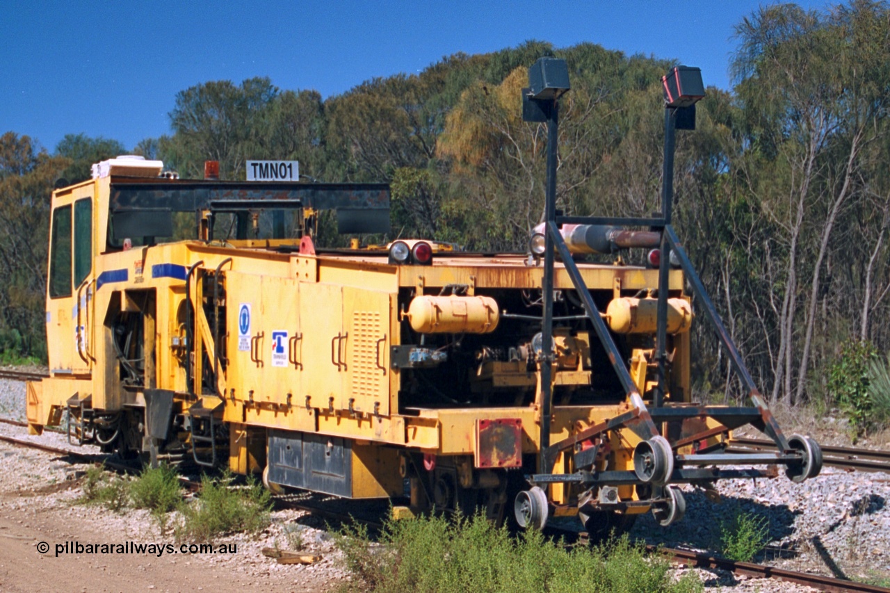 244-19
Coomunga, on the siding, Transfield track machine TMN 01 which is a track tamper. 6th April, 2003.
Keywords: track-machine;