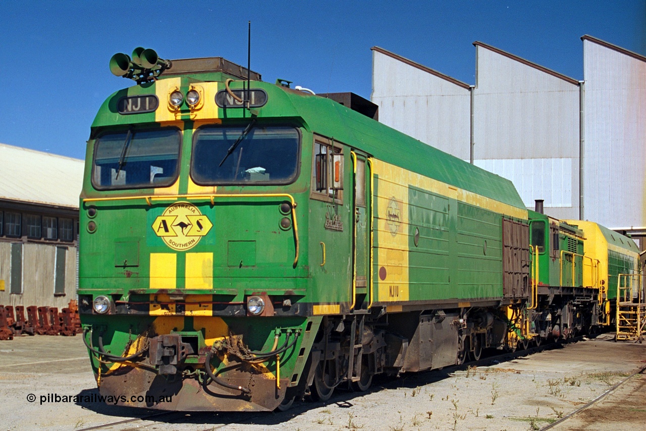 244-21
Port Lincoln loco workshops, still wearing the former owners AN livery, Australian Southern NJ class leader NJ 1 'Ben Chifley' Clyde Engineering EMD model JL22C serial 71-728, in multiple unit consist, roster shot. 6th April, 2003.
Keywords: NJ-class;NJ1;Clyde-Engineering-Granville-NSW;EMD;JL22C;71-728;