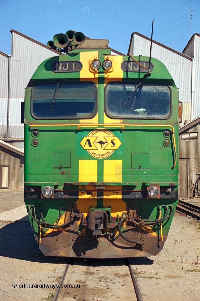 244-22
Port Lincoln loco workshops, still wearing the former owners AN livery, Australian Southern NJ class leader NJ 1 'Ben Chifley' Clyde Engineering EMD model JL22C serial 71-728, cab front view. 6th April, 2003
Keywords: NJ-class;NJ1;Clyde-Engineering-Granville-NSW;EMD;JL22C;71-728;