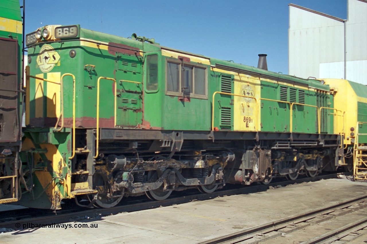 244-23
Port Lincoln loco workshops, still wearing the former owners AN livery, Australian Southern 830 class 869 AE Goodwin ALCo model DL531 serial G6016-05, sandwiched between two NJ class units. 6th April, 2003.
Keywords: 830-class;869;AE-Goodwin;ALCo;DL531;G6016-5;