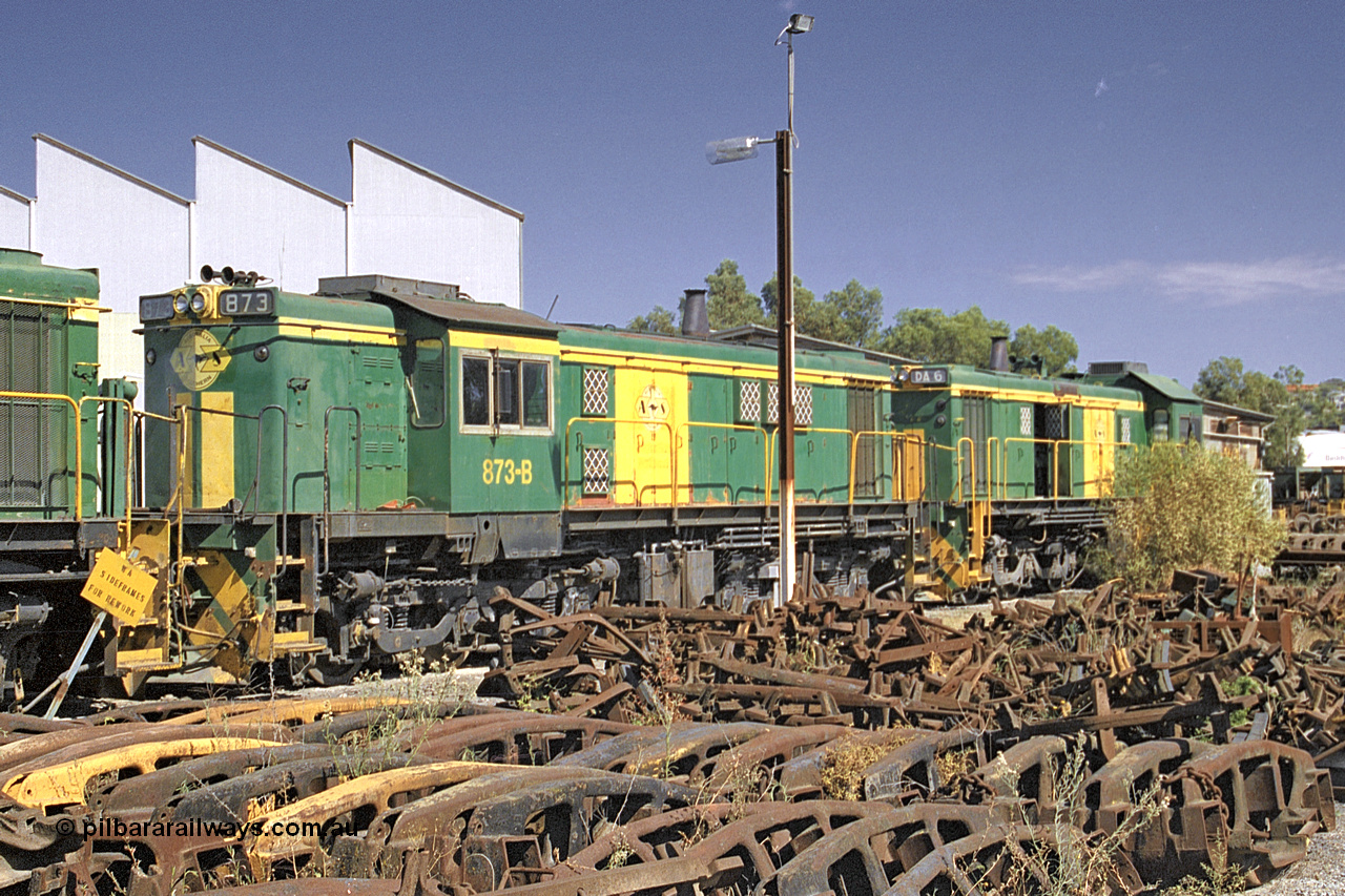 245-03
Port Lincoln loco workshops, still in former owner Australian National livery, Australian Southern narrow gauge 830 class locomotive 873 in an AE Goodwin built ALCo DL531 model with serial G3422-3 built new for the SAR in 1966 and delivered new to Port Lincoln in April 1966, it has spent it's whole working life on the Eyre Peninsula. 6th April 2003.
Keywords: 830-class;873;G3422-3;AE-Goodwin;ALCo;DL531;