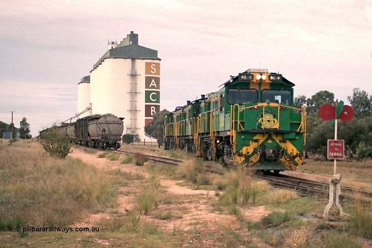 245-20
Wudinna, empty grain train locos shunt back towards the mainline having dropped waggons in the siding, a trio of former Australian National Co-Co locomotives with rebuilt former AE Goodwin ALCo model DL531 830 class ex 839, serial no. 83730, rebuilt by Port Augusta Workshops to DA class, DA 4 leading two AE Goodwin ALCo model DL531 830 class units 842, serial no. 84140 and 851 serial no. 84137, 851 having been on the Eyre Peninsula since delivered in 1962. 7th April, 2003.
Keywords: DA-class;DA4;83730;Port-Augusta-WS;ALCo;DL531G/1;830-class;839;rebuild;