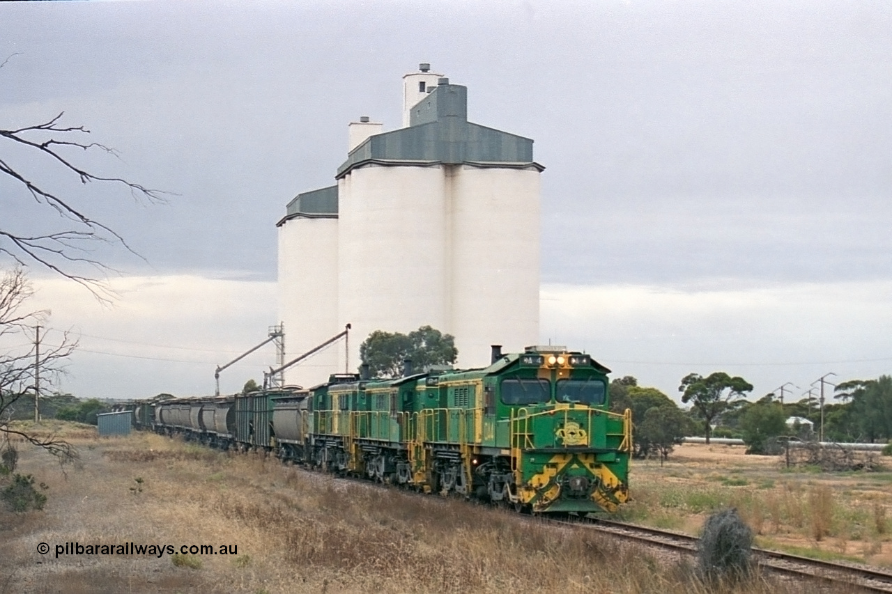 245-27
Yaninee, empty grain train behind a trio of former Australian National Co-Co locomotives with rebuilt former AE Goodwin ALCo model DL531 830 class ex 839, serial no. 83730, rebuilt by Port Augusta Workshops to DA class, leading two AE Goodwin ALCo model DL531 830 class units 842, serial no. 84140 and 851 serial no. 84137, 851 having been on the Eyre Peninsula since delivered in 1962, runs through express on the mainline. 7th April, 2003.
Keywords: DA-class;DA4;83730;Port-Augusta-WS;ALCo;DL531G/1;830-class;839;rebuild;