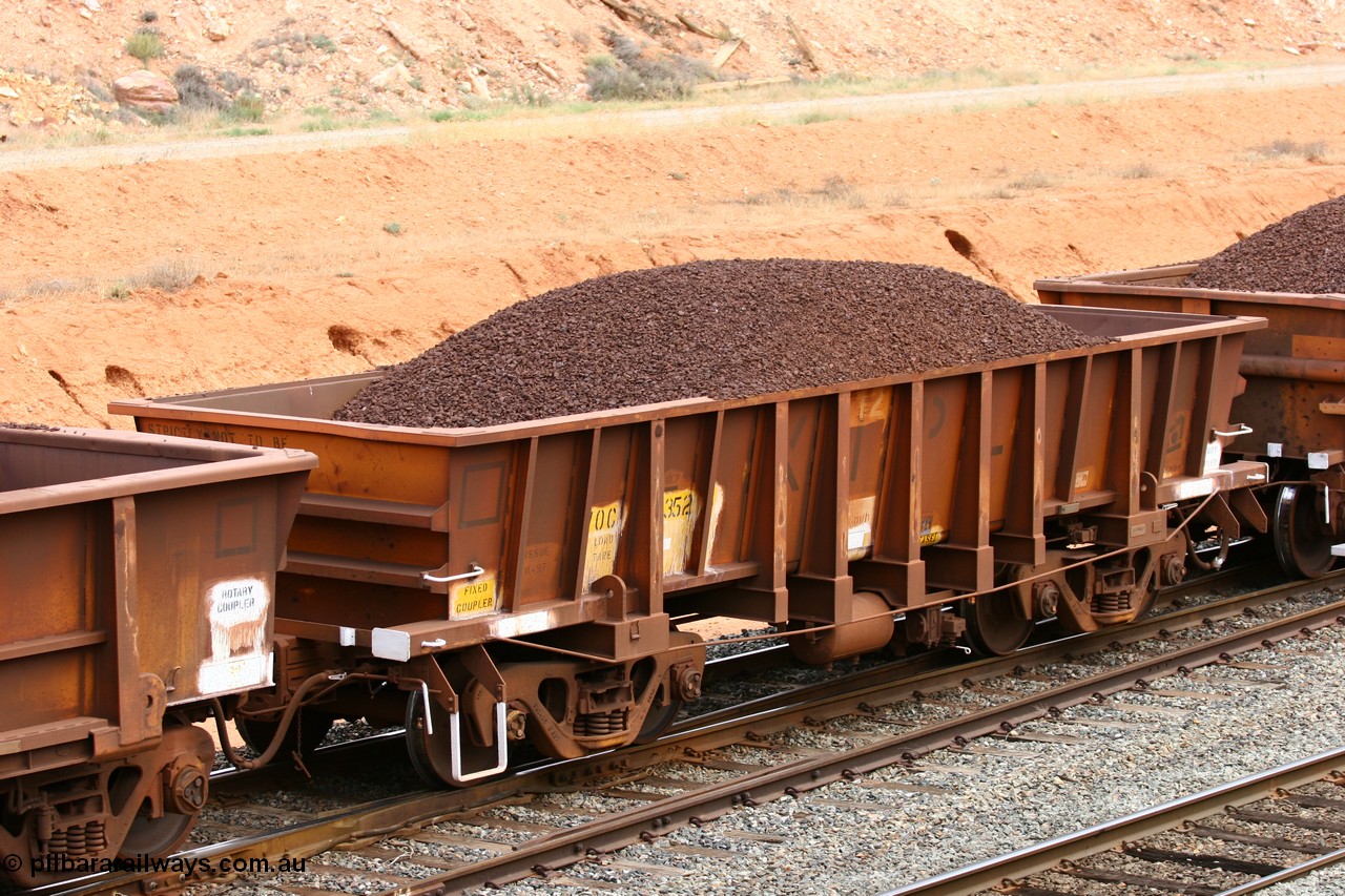 060116 2682
WOC type iron ore waggon WOC 31352 is one of a batch of thirty built by Goninan WA between October 1997 to January 1998 with fleet number 412 for Koolyanobbing iron ore operations with a 75 ton capacity built by Goninan in 1997-98 for Koolyanobbing Iron Ore Pty Ltd and lettered KIPL, loaded with lump ore at West Kalgoorlie, 16th January 2006.
Keywords: WOC-type;WOC31352;Goninan-WA;