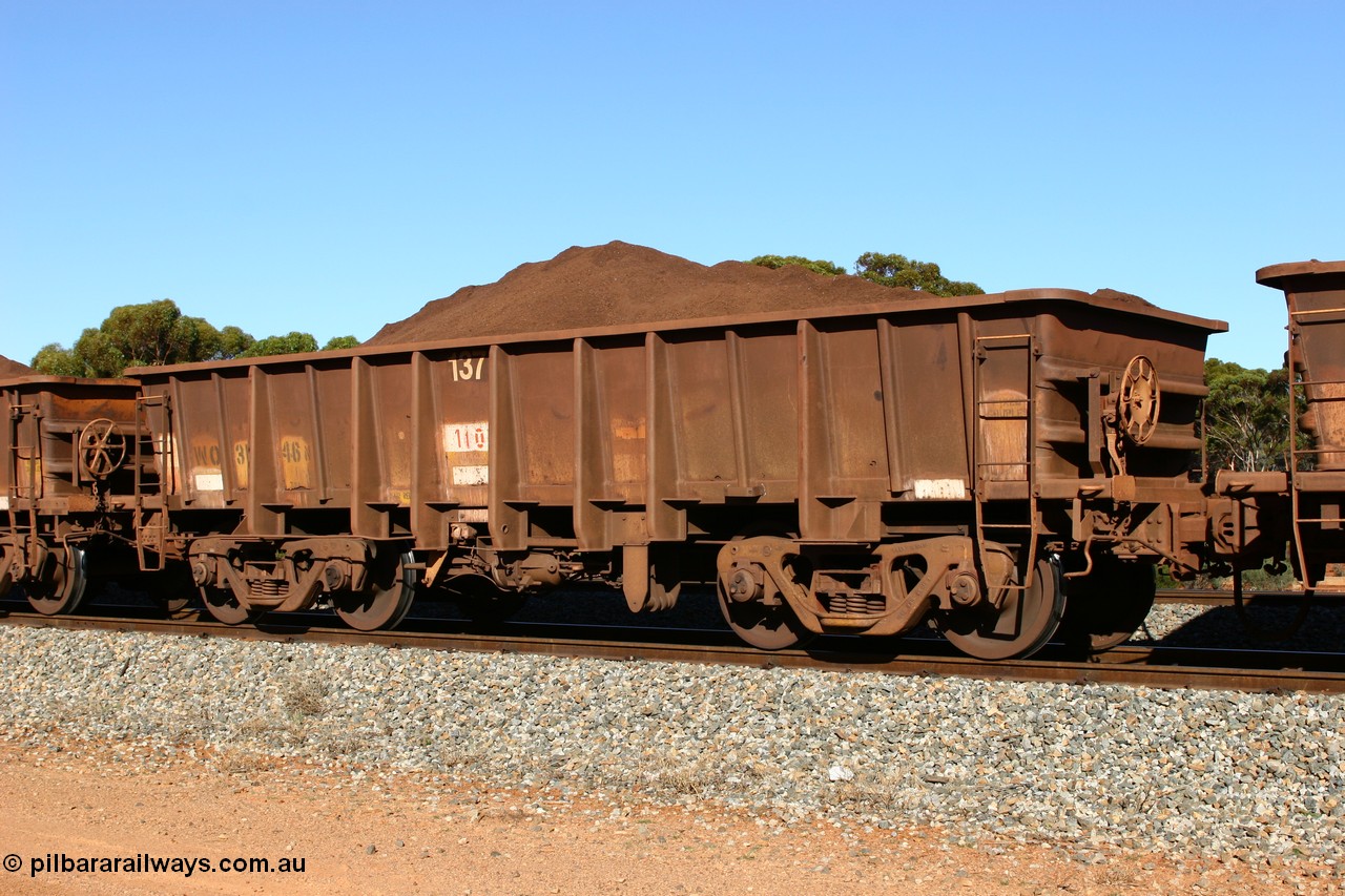 060528 4572
WO type iron ore waggon WO 31246 is one of a batch of eighty six built by WAGR Midland Workshops between 1967 and March 1968 with fleet number 137 for Koolyanobbing iron ore operations, with a 75 ton and 1018 ft³ capacity, seen here loaded with fines ore at Bonnie Vale, 28th May 2006. This unit was converted to WOC for coal in 1986 till 1994 when it was re-classed back to WO.
Keywords: WO-type;WO31246;WAGR-Midland-WS;