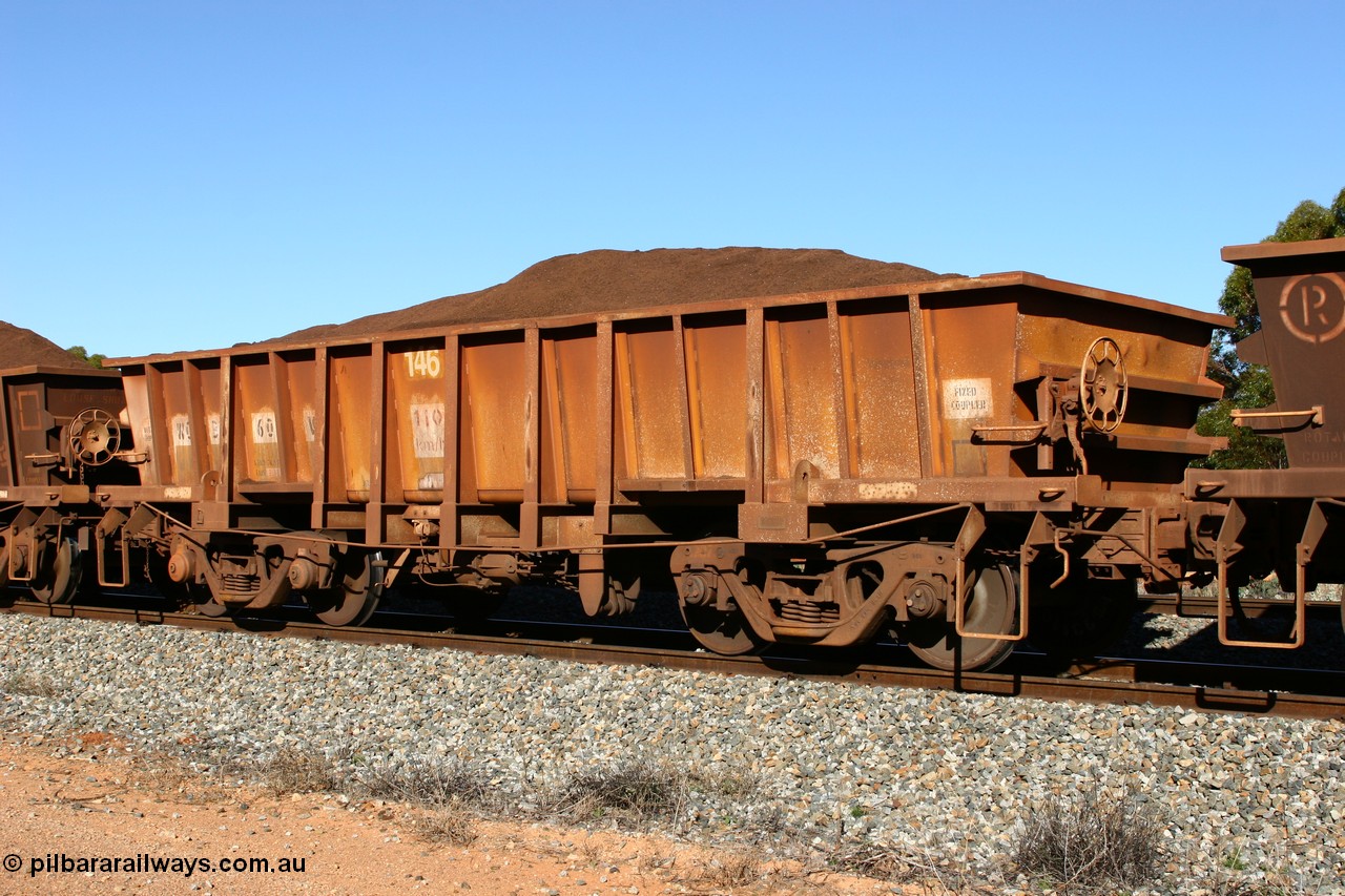 060528 4575
WO type iron ore waggon WO 31260 is one of a batch of sixty two built by Goninan WA between April and August 2000 with serial number 950086-010 and fleet number 146 for Koolyanobbing iron ore operations, and is a Goninan built replacement WO type waggon that replaces the original WAGR built WO type waggon with the newer style WOD type and has square features opposed to the curved ones as on the original WO class, seen here loaded with fines ore on train 413 at Bonnie Vale, 28th May 2006.
Keywords: WO-type;WO31260;Goninan-WA;950086-010;