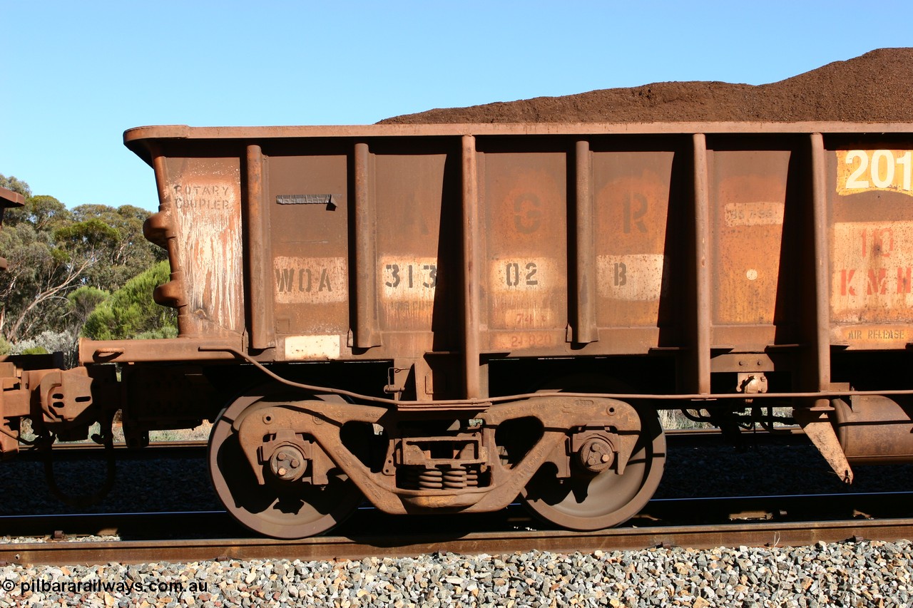 060528 4579
WOA type iron ore waggon WOA 31302 is leader of a batch of thirty nine built by WAGR Midland Workshops between 1970 and 1971 with fleet number 201 for Koolyanobbing iron ore operations, with a 75 ton and 1018 ft³ capacity, seen here with fines ore at Bonnie Vale, 28th May 2006.
Keywords: WOA-type;WOA31302;WAGR-Midland-WS;type-leader;