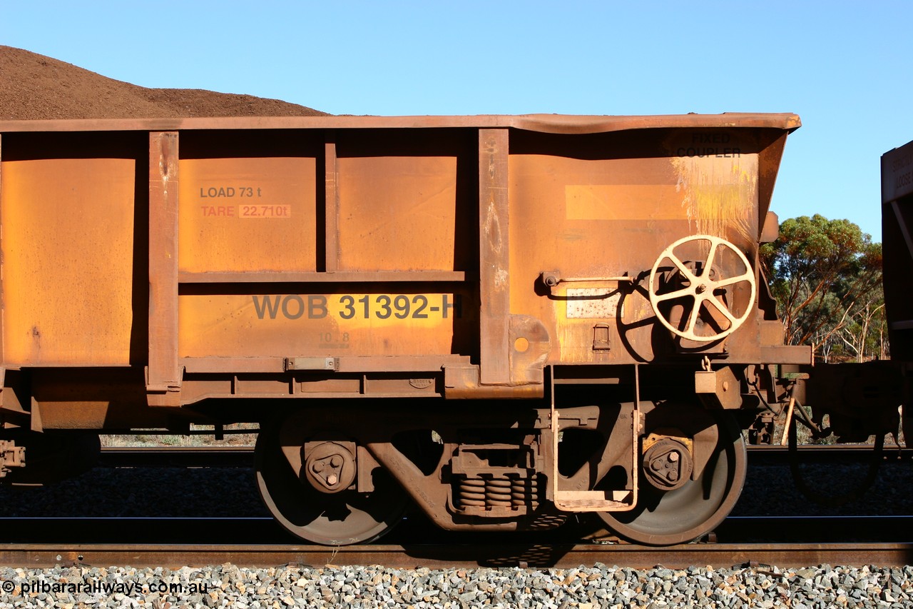 060528 4585
WOB type iron ore waggon WOB 31392 is one of a batch of twenty five built by Comeng WA between 1974 and 1975 and converted from Mt Newman high sided waggons by WAGR Midland Workshops with fleet number 317 for Koolyanobbing iron ore operations, shows the higher tare of these waggons and the capacity of 73 tons, waggon length of 10.8 metres, and a close inspection reveals that the round WAGR waggon builder's number is 31391 of 1974, this waggon cut down originally from a Comeng built Mt Newman Mining ore waggon in 1974. It was then converted to a WSM ballast hopper, then converted back to a WOB by WAGR Midland Workshops. It was originally numbered 31391 by WAGR, seen here loaded with fines at Bonnie Vale, 28th May 2006.
Keywords: WOB-type;WOB31392;Comeng-WA;WSM-type;Mt-Newman-Mining;