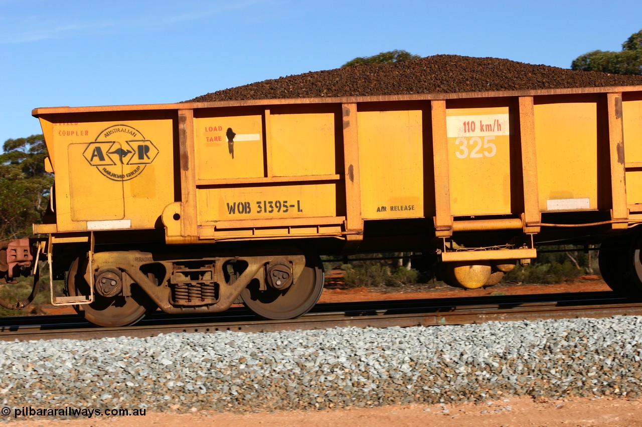 060530 4970
WOB type iron ore waggon WOB 31395 is one of a batch of twenty five built by Comeng WA between 1974 and 1975 and converted from Mt Newman high sided waggons by WAGR Midland Workshops with a capacity of 67 tons with fleet number 325 for Koolyanobbing iron ore operations. This waggon was also converted to a WSM type ballast hopper by re-fitting the cut down top section and having bottom discharge doors fitted, converted back to WOB in 1997, and this is the first one to be repainted in ARG yellow, loaded with lump ore, Binduli 30th May 2006.
Keywords: WOB-type;WOB31395;Comeng-WA;WSM-type;Mt-Newman-Mining;