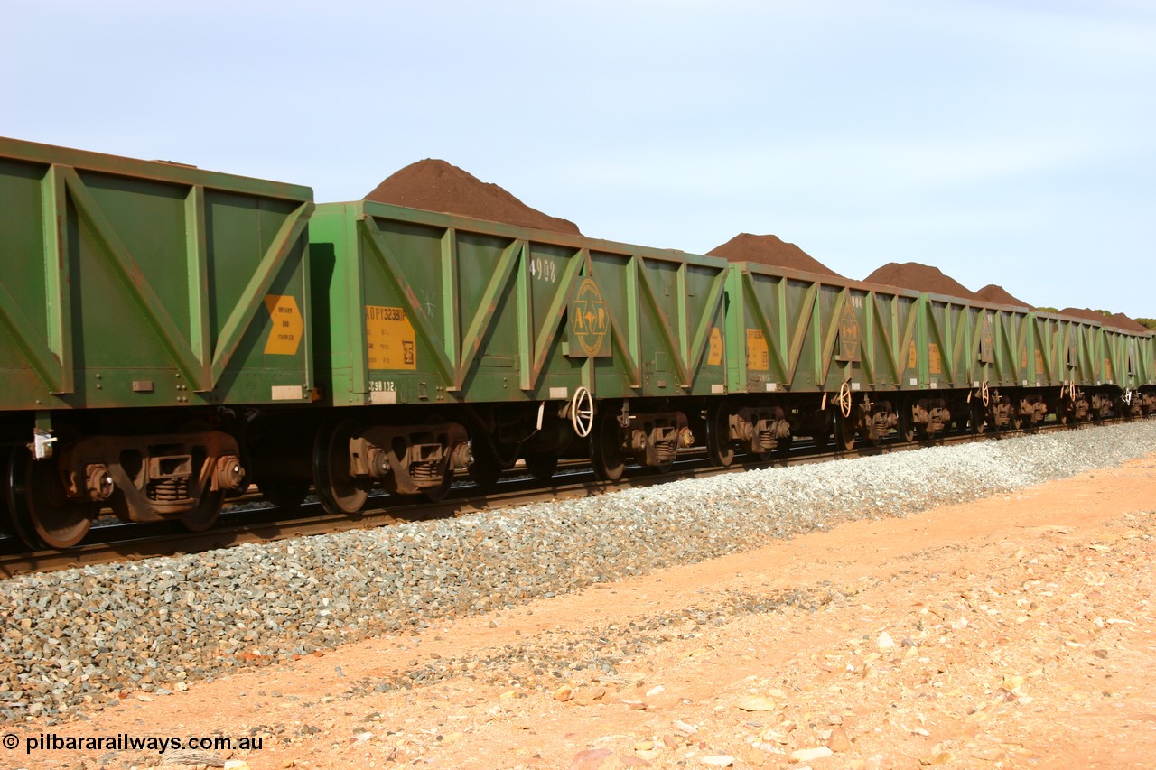 060531 5002
Binduli, AOPY 32380, fleet number 4908, the 4 being a recent addition, one of seventy ex ANR coal waggons rebuilt from AOKF type by Bluebird Engineering SA in service with ARG on Koolyanobbing iron ore trains. They used to be three metres longer and originally built by Metropolitan Cammell Britain as GB type in 1952-55, seen here in the consist with sister waggons of a loaded train bound for West Kalgoorlie, 31st May 2006.
Keywords: AOPY-type;AOPY32380;Bluebird-Engineering-SA;Metropolitan-Cammell-Britain;GB-type;