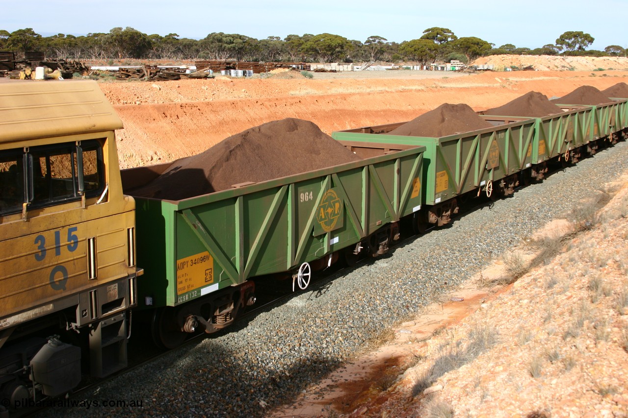 060531 5020
West Kalgoorlie, AOPY 34096 with fleet number 964 and of the drop floor type, one of seventy ex ANR coal waggons rebuilt from AOKF type by Bluebird Engineering SA in service with ARG on Koolyanobbing iron ore trains. They used to be three metres longer and originally built by Metropolitan Cammell Britain as GB type in 1952-55, 31st May 2006.
Keywords: AOPY-type;AOPY34096;Bluebird-Engineering-SA;Metropolitan-Cammell-Britain;GB-type;