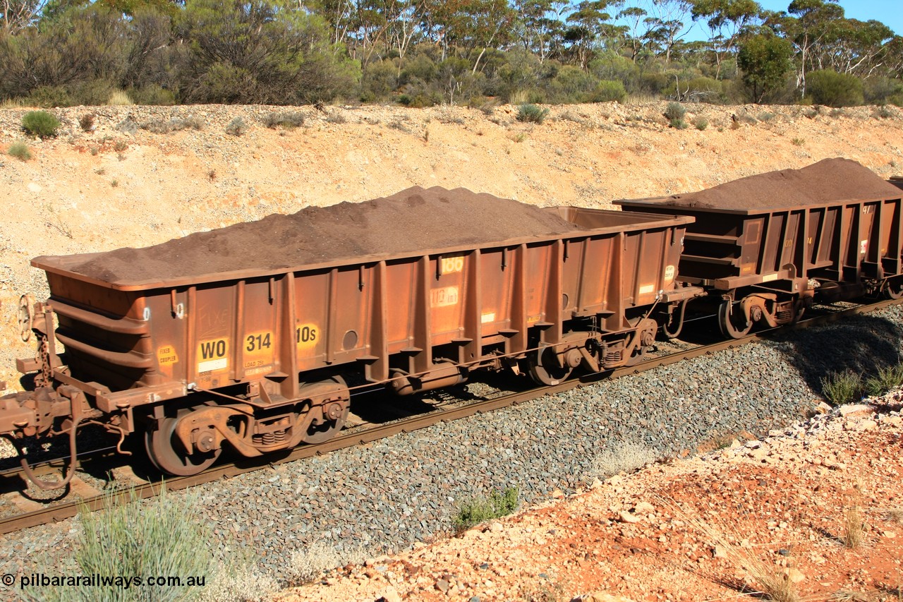 100602 8539
WO type iron ore waggon WO 31410 is one of a batch of eleven replacement waggons built by WAGR Midland Workshops between 1970 and 1971 with fleet number 186 for Koolyanobbing iron ore operations, with a 75 ton and 1018 ft³ capacity, loaded with fines just west of Binduli, 2nd June 2010.
Keywords: WO-type;WO31410;WAGR-Midland-WS;