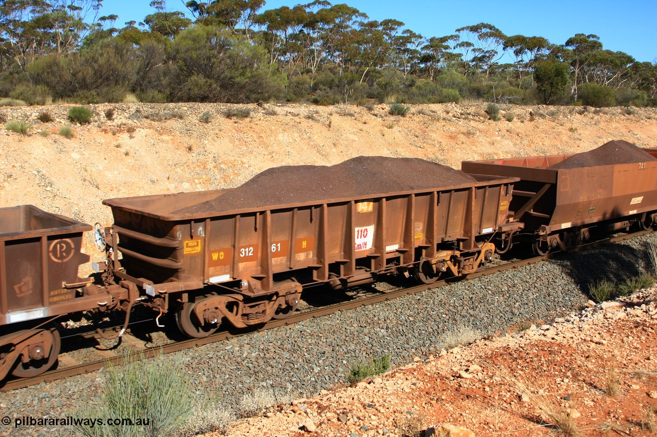 100602 8564
WO type iron ore waggon WO 31261 is one of a batch of eighty six built by WAGR Midland Workshops between 1967 and March 1968 with fleet number 147 for Koolyanobbing iron ore operations, with a 75 ton and 1018 ft³ capacity, seen here loaded with fines and having had the numbers re-painted, Binduli, 2nd June 2010.
Keywords: WO-type;WO31261;WAGR-Midland-WS;