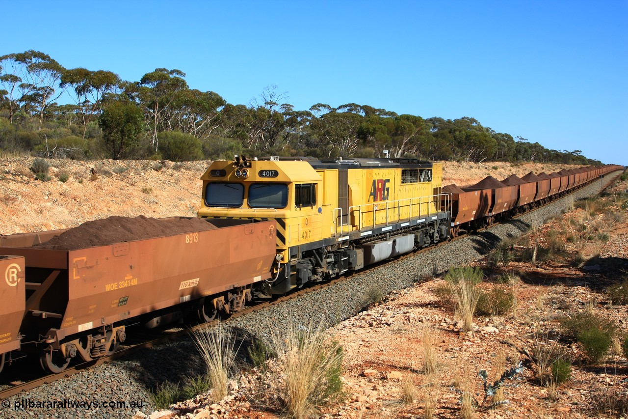 100602 8570
WOE type iron ore waggon WOE 33414 is one of a batch of one hundred and forty one built by United Group Rail WA between November 2005 and April 2006 with serial number 950142-119 and fleet number 8913 for Koolyanobbing iron ore operations, the 8 being a addition due to fleet size, and a build date of 04/2006 with a revised load of 82.5 tonnes with PORTMAN painted out, seen here with mid-train DPU locomotive Q 4017 and train out over the grade, west of Binduli, 2nd June 2010.
Keywords: WOE-type;WOE33414;United-Group-Rail-WA;950142-119;Q4017;Q-type;