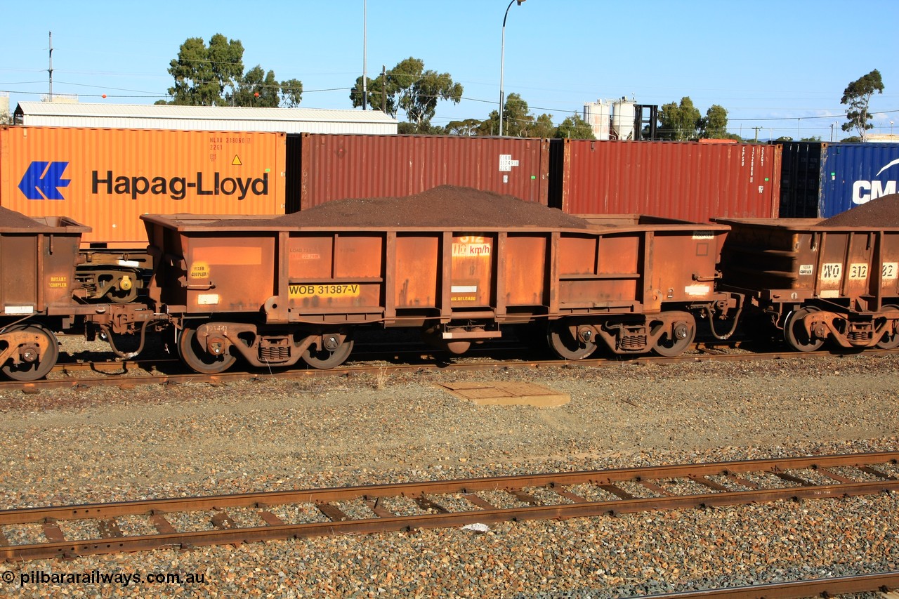 100602 8680
WOB type iron ore waggon WOB 31387 is one of a batch of twenty five built by Comeng WA between 1974 and 1975 and converted from Mt Newman high sided waggons by WAGR Midland Workshops with a capacity of 67 tons with fleet number 312 for Koolyanobbing iron ore operations. This waggon was also converted to a WSM type ballast hopper by re-fitting the cut down top section and having bottom discharge doors fitted, converted back to WOB in 1998, loaded with fines in West Kalgoorlie, 2nd June 2010.
Keywords: WOB-type;WOB31387;Comeng-WA;WSM-type;Mt-Newman-Mining;