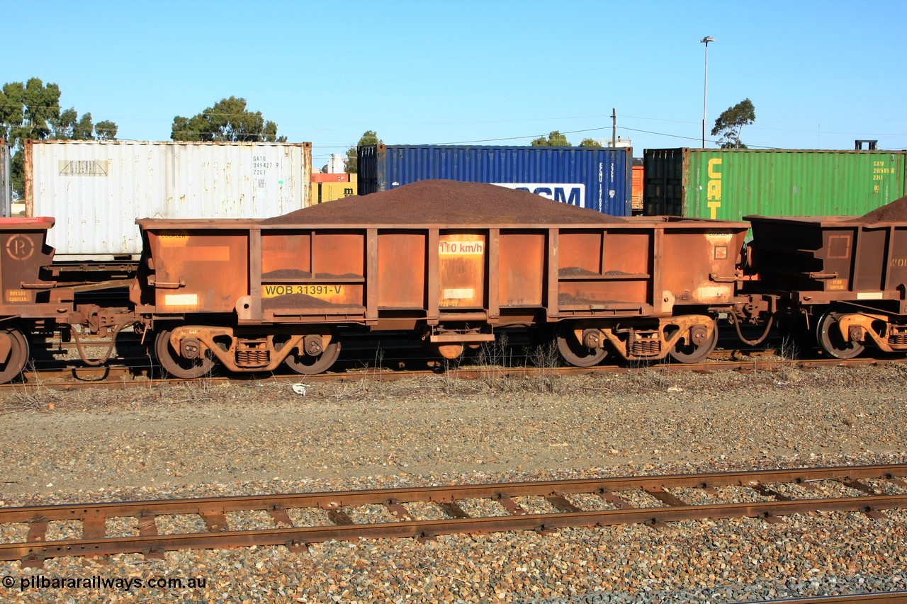 100602 8685
WOB type iron ore waggon WOB 31391 is one of a batch of twenty five built by Comeng WA between 1974 and 1975 and converted from Mt Newman high sided waggons by WAGR Midland Workshops with a capacity of 67 tons with fleet number 316 for Koolyanobbing iron ore operations. This waggon was also converted to a WSM type ballast hopper by re-fitting the cut down top section and having bottom discharge doors fitted, converted back to WOB in 1998, loaded with fines in West Kalgoorlie 2nd June 2010.
Keywords: WOB-type;WOB31391;Comeng-WA;WSM-type;Mt-Newman-Mining;