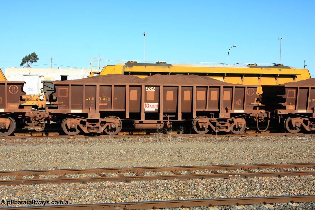 100602 8695
WOD type iron ore waggon WOD 31469 is one of a batch of sixty two built by Goninan WA between April and August 2000 with serial number 950086-041 and fleet number 532 for Koolyanobbing iron ore operations with a 75 ton capacity and build date 06/2000, for Portman Mining to cart their Koolyanobbing iron ore to Esperance, with the letters now painted over, loaded with fines ore, West Kalgoorlie 2nd June 2010.
Keywords: WOD-type;WOD31469;Goninan-WA;950086-041;