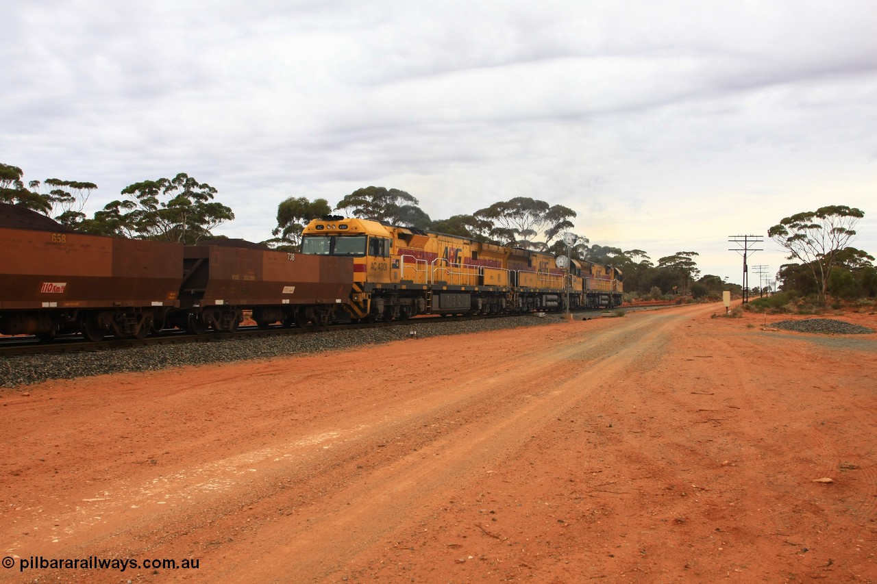 100605 9326
Binduli Triangle, trailing view of triple AC class locomotives powering away towards Esperance with WOE type iron ore waggon WOE 33239 is one of a batch of twenty seven built by Goninan WA between September and October 2002 with serial number 950103-006 and fleet number 738 for Koolyanobbing iron ore operations and 125 other waggons behind their draw gear, 5th June 2010.
Keywords: WOE-type;WOE33239;Goninan-WA;950103-006;