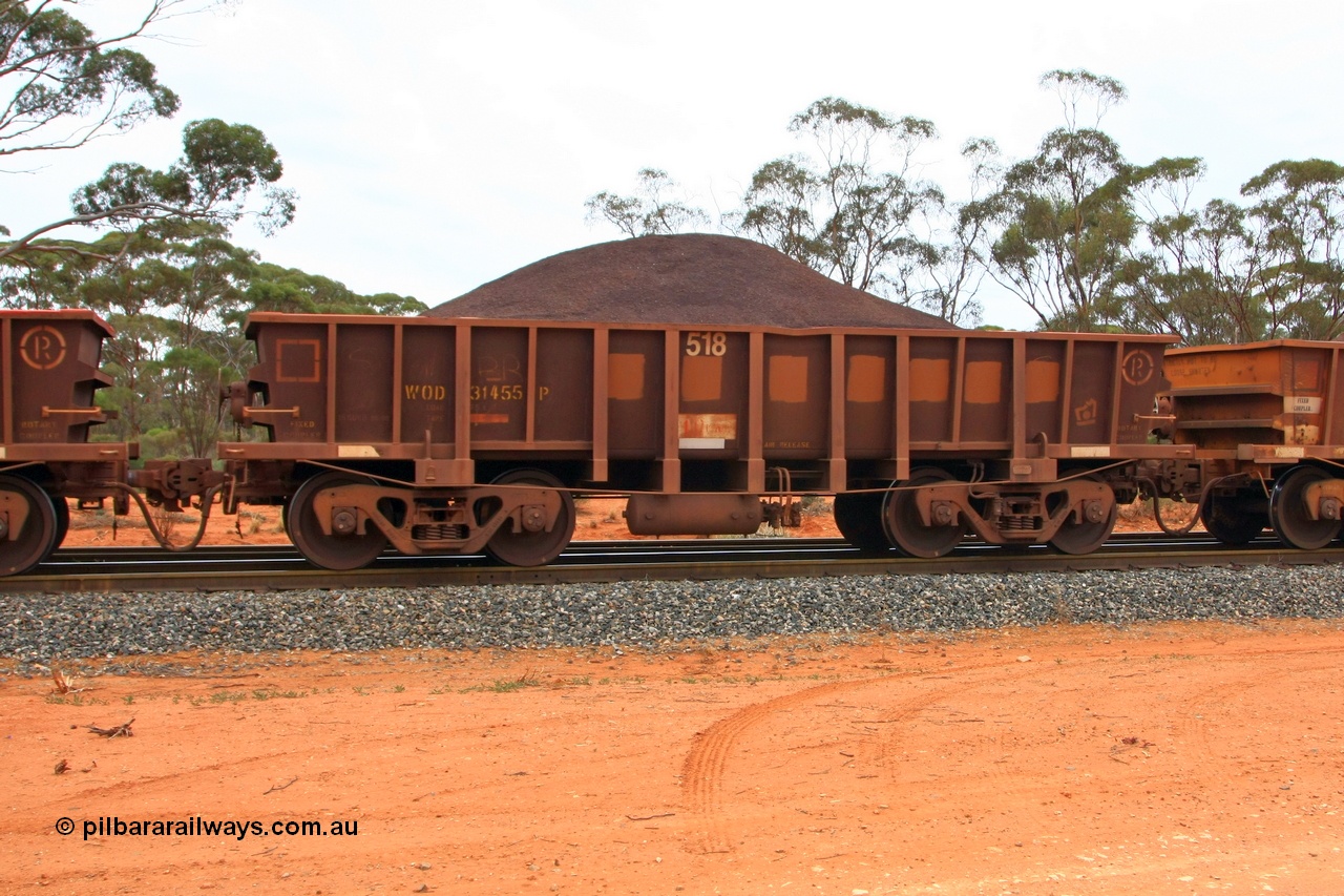 100605 9335
WOD type iron ore waggon WOD 31455 is one of a batch of sixty two built by Goninan WA between April and August 2000 with serial number 950086-027 and fleet number 518 for Koolyanobbing iron ore operations with a 75 ton capacity for Portman Mining to cart their Koolyanobbing iron ore to Esperance, now with PORTMAN painted out, Binduli Triangle, loaded with fines, 5th June 2010.
Keywords: WOD-type;WOD31455;Goninan-WA;950086-027;