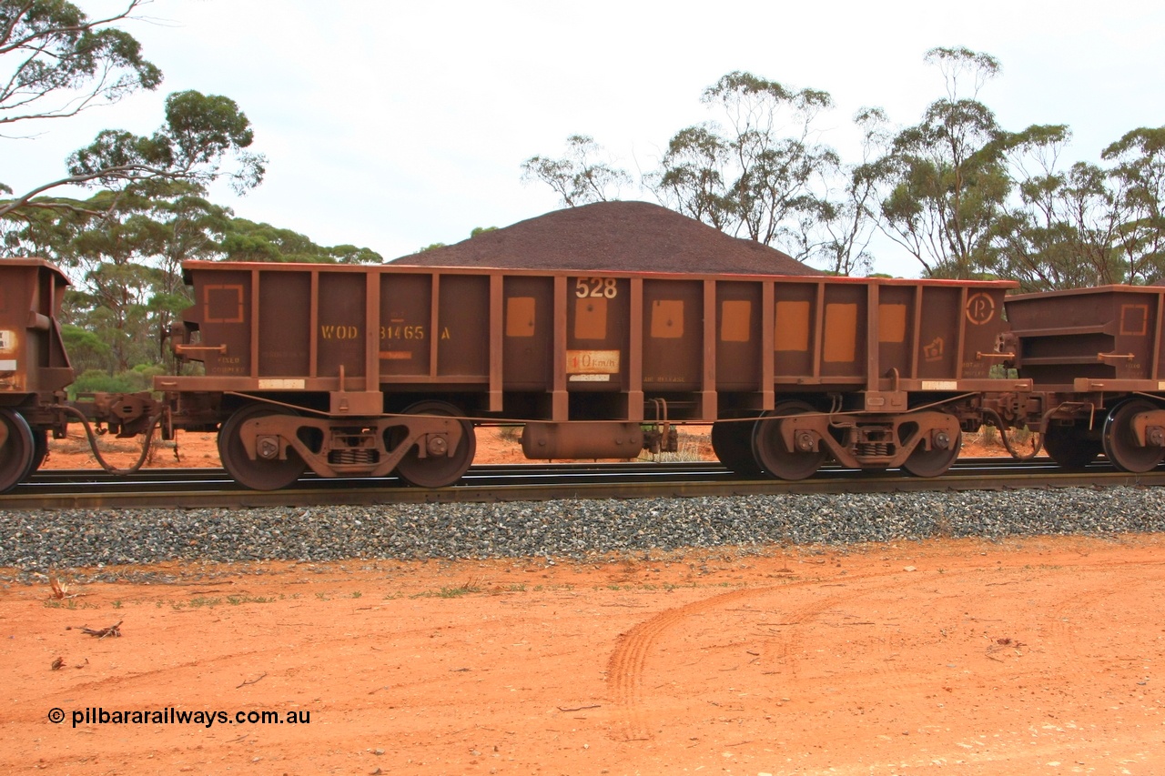 100605 9336
WOD type iron ore waggon WOD 31465 is one of a batch of sixty two built by Goninan WA between April and August 2000 with serial number 950086-037 and fleet number 528 for Koolyanobbing iron ore operations with a 75 ton capacity for Portman Mining to cart their Koolyanobbing iron ore to Esperance, now with PORTMAN painted out, Binduli Triangle, loaded with fines, 5th June 2010.
Keywords: WOD-type;WOD31465;Goninan-WA;950086-037;