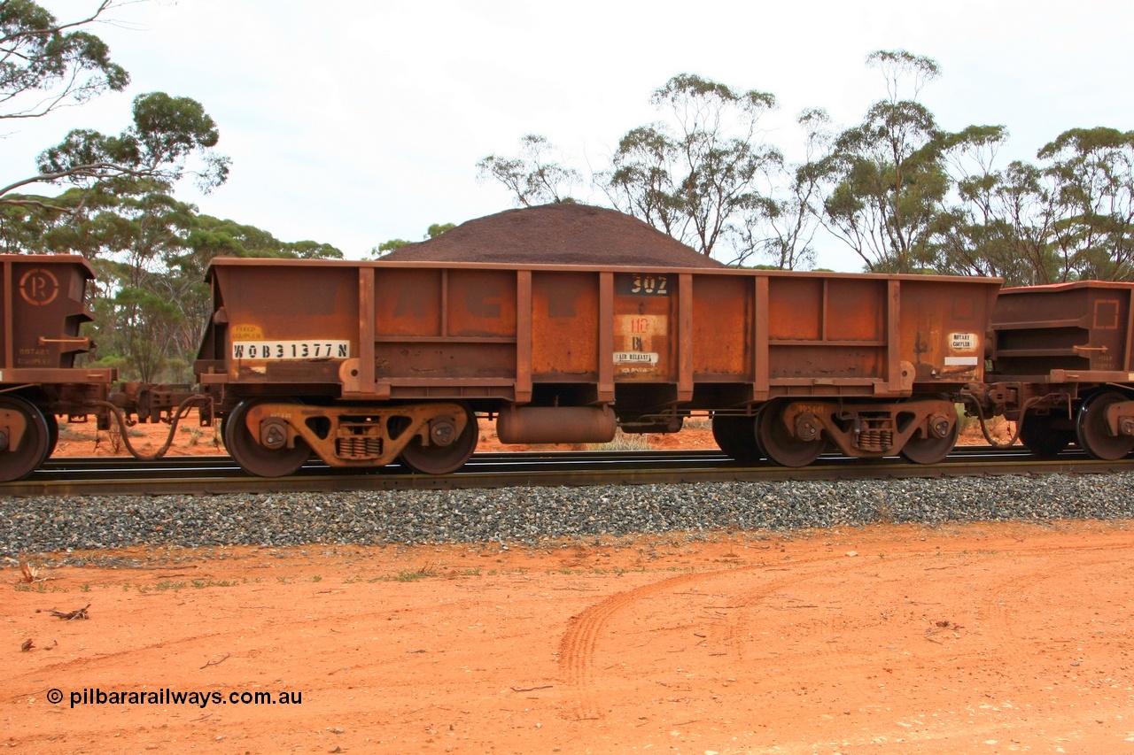100605 9337
WOB type iron ore waggon WOB 31377 is one of a batch of twenty five built by Comeng WA between 1974 and 1975 and converted from Mt Newman high sided waggons by WAGR Midland Workshops with a capacity of 67 tons with fleet number 302 for Koolyanobbing iron ore operations, loaded with fines, West Kalgoorlie 2nd June 2010.
Keywords: WOB-type;WOB31377;Comeng-WA;Mt-Newman-Mining;