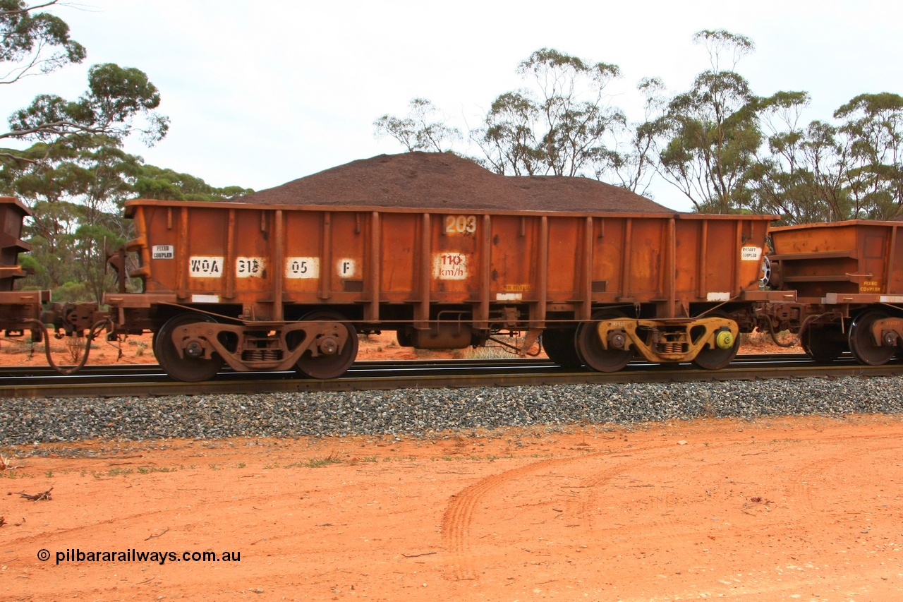 100605 9351
WOA type iron ore waggon WOA 31305 is one of a batch of thirty nine built by WAGR Midland Workshops between 1970 and 1971 with fleet number 203 for Koolyanobbing iron ore operations, with a 75 ton and 1018 ft³ capacity, Binduli Triangle, loaded with fines, 5th June 2010.
Keywords: WOA-type;WOA31305;WAGR-Midland-WS;