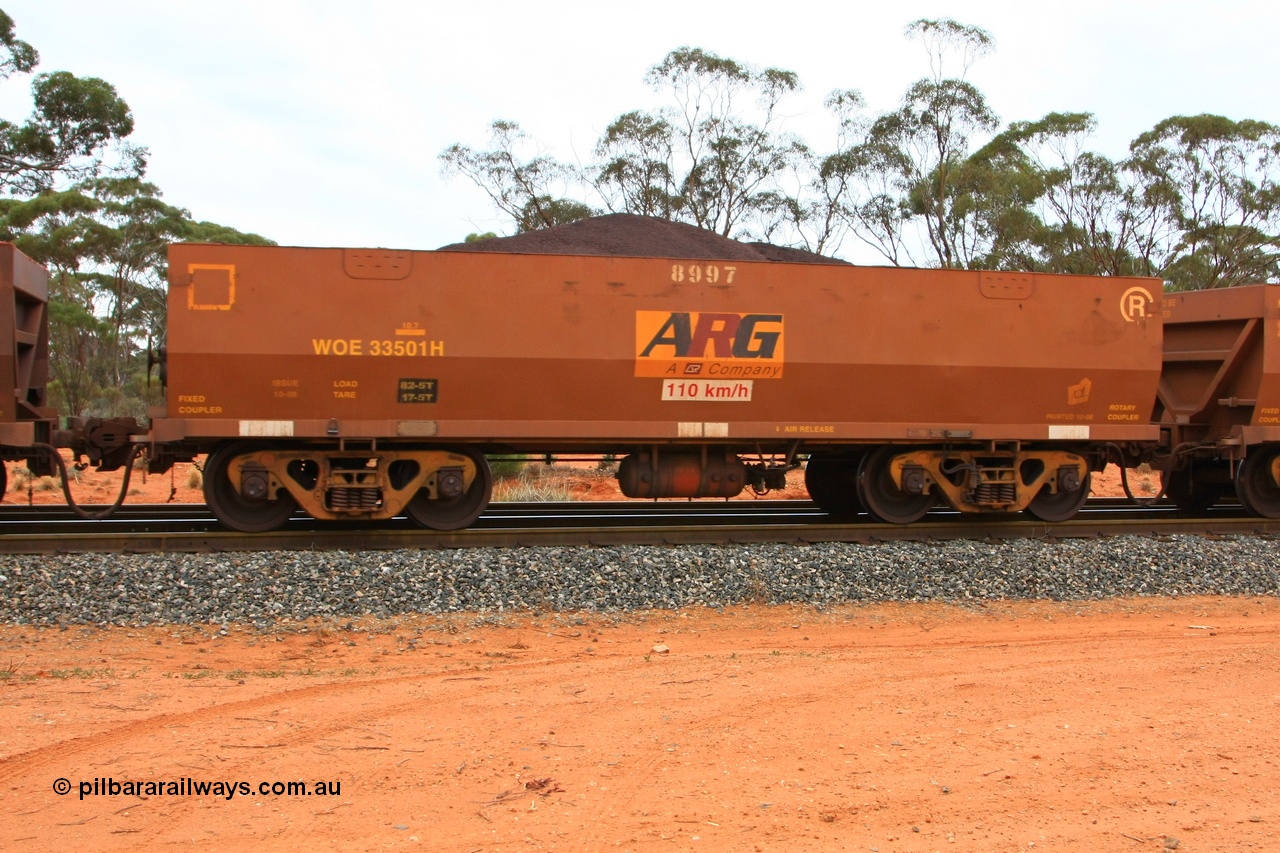 100605 9354
WOE type iron ore waggon WOE 33501 is one of a batch of one hundred and twenty eight built by United Group Rail WA between August 2008 and March 2009 with serial number 950211-041 and fleet number 8997 for Koolyanobbing iron ore operations, with ARG decal, build date of 10/2008 and revised load of 82.5 tonnes, seen here Binduli Triangle 5th June 2010.
Keywords: WOE-type;WOE33501;United-Group-Rail-WA;950211-041;