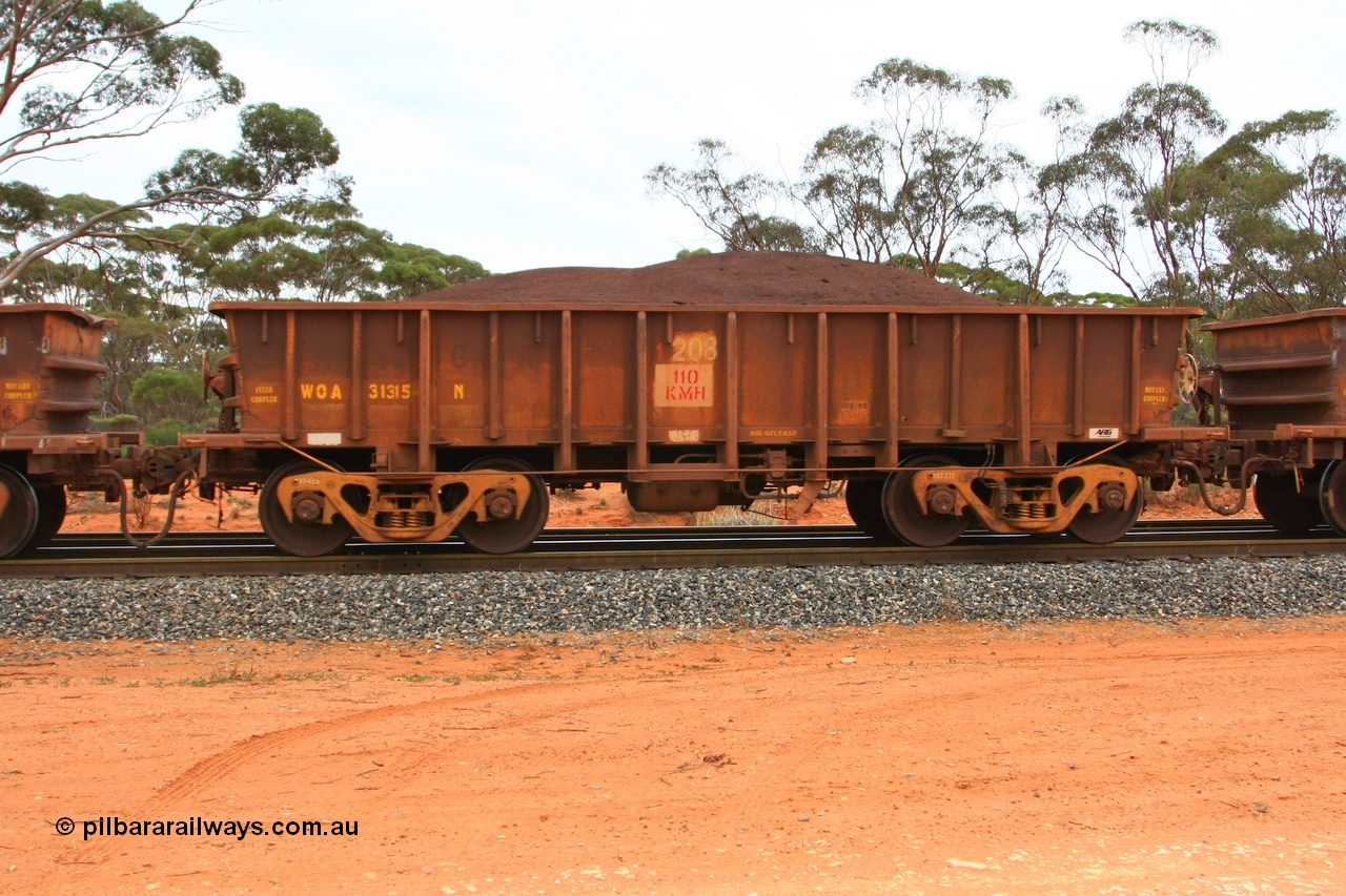 100605 9372
WOA type iron ore waggon WOA 31315 is one of a batch of thirty nine built by WAGR Midland Workshops between 1970 and 1971 with fleet number 208 for Koolyanobbing iron ore operations, with a 75 ton and 1018 ft³ capacity, Binduli Triangle, loaded with fines, 5th June 2010.
Keywords: WOA-type;WOA31315;WAGR-Midland-WS;