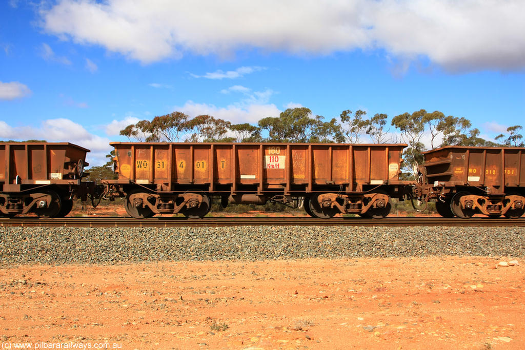 100729 01498
WO type iron ore waggon WO 31401 is leader of a batch of eleven replacement waggons built by WAGR Midland Workshops between 1970 and 1971 with fleet number 180 for Koolyanobbing iron ore operations, with a 75 ton and 1018 ft³ capacity. This unit was converted to WOC for coal in 1986 till 1994 when it was re-classed back to WO. On loaded train 7415 at Binduli Triangle, 29th July 2010.
Keywords: WO-type;WO31401;WAGR-Midland-WS;