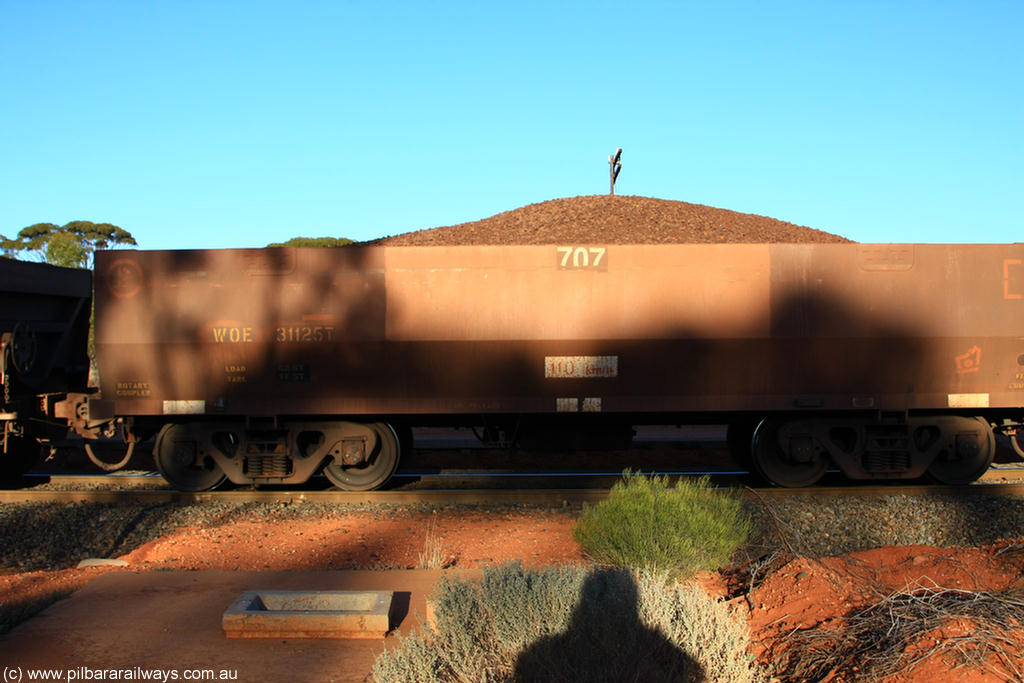 100731 02283
WOE type iron ore waggon WOE 31125 is one of a batch of one hundred and thirty built by Goninan WA between March and August 2001 with serial number 950092-115 and fleet number 707 for Koolyanobbing iron ore operations, on loaded train 6413 at Binduli Triangle, 31st July 2010.
Keywords: WOE-type;WOE31125;Goninan-WA;950092-115;