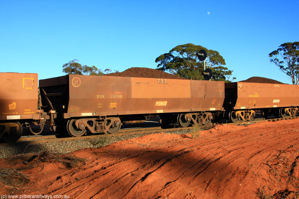100731 02290
WOE type iron ore waggon WOE 33238 is one of a batch of twenty seven built by Goninan WA between September and October 2002 with serial number 950103-005 and fleet number 737 for Koolyanobbing iron ore operations, on loaded train 6413 at Binduli Triangle, 31st July 2010.
Keywords: WOE-type;WOE33238;Goninan-WA;950103-005;