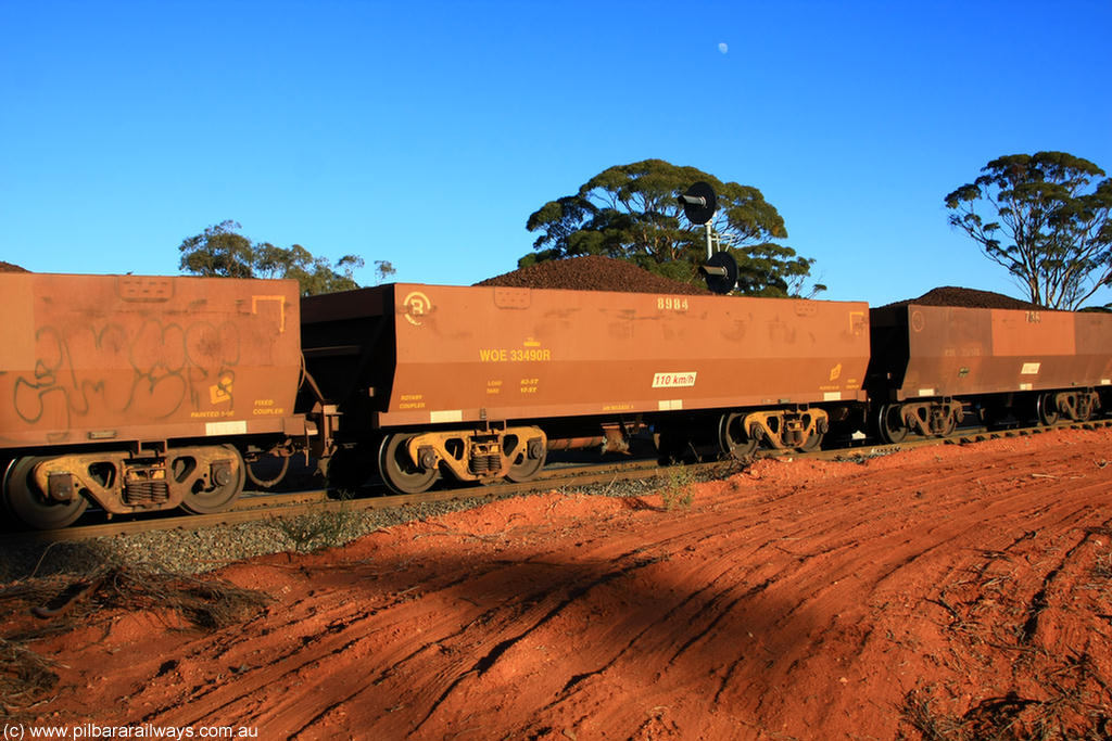 100731 02294
WOE type iron ore waggon WOE 33490 is one of a batch of one hundred and twenty eight built by United Group Rail WA between August 2008 and March 2009 with serial number 950211-030 and fleet number 8984 for Koolyanobbing iron ore operations, on loaded train 6413 at Binduli Triangle, 31st July 2010.
Keywords: WOE-type;WOE33490;United-Group-Rail-WA;950211-030;