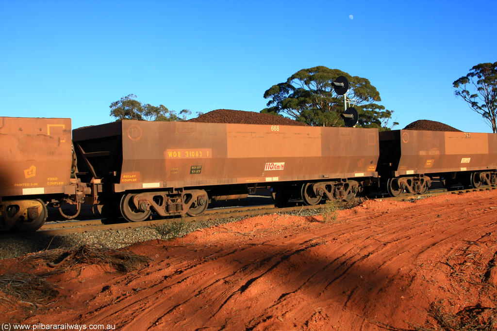 100731 02322
WOE type iron ore waggon WOE 31083 is one of a batch of one hundred and thirty built by Goninan WA between March and August 2001 with serial number 950092-073 and fleet number 668 for Koolyanobbing iron ore operations, on loaded train 6413 at Binduli Triangle, 31st July 2010.
Keywords: WOE-type;WOE31083;Goninan-WA;950092-073;