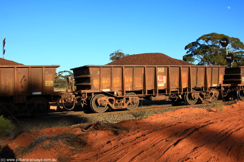 100731 02343
WO type iron ore waggon WO 31262 is one of a batch of eighty six built by WAGR Midland Workshops between 1967 and March 1968 with fleet number 148 for Koolyanobbing iron ore operations, with a 75 ton and 1018 ft³ capacity, on loaded train 6413 at Binduli Triangle, 31st July 2010. This unit was converted to WOC for coal in 1986 till 1994 when it was re-classed back to WO.
Keywords: WO-type;WO31262;WAGR-Midland-WS;