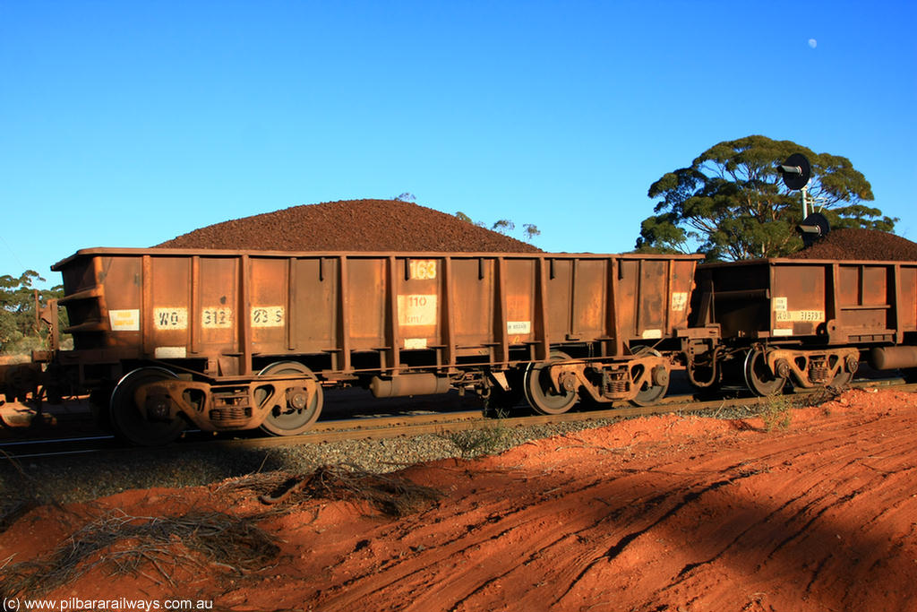 100731 02345
WO type iron ore waggon WO 31283 is one of a batch of eighty six built by WAGR Midland Workshops between 1967 and March 1968 with fleet number 163 for Koolyanobbing iron ore operations, with a 75 ton and 1018 ft³ capacity, on loaded train 6413 at Binduli Triangle, 31st July 2010. This unit was converted to WOS superphosphate in the late 1980s till 1994 when it was re-classed back to WO.
Keywords: WO-type;WO31283;31283;WAGR-Midland-WS;WOS-type;