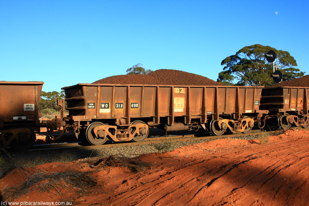 100731 02347
WO type iron ore waggon WO 31269 is one of a batch of eighty six built by WAGR Midland Workshops between 1967 and March 1968 with fleet number 152 for Koolyanobbing iron ore operations, with a 75 ton and 1018 ft³ capacity, on loaded train 6413 at Binduli Triangle, 31st July 2010. This unit was converted to WOC for coal in 1986 till 1994 when it was re-classed back to WO.
Keywords: WO-type;WO31269;WAGR-Midland-WS;