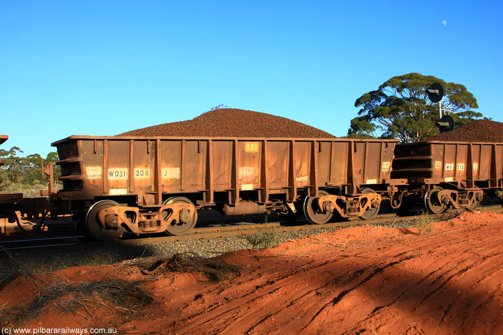 100731 02352
WO type iron ore waggon WO 31204 is one of a batch of eighty six built by WAGR Midland Workshops between 1967 and March 1968 with fleet number 101 for Koolyanobbing iron ore operations with a 75 ton and 1018 ft.³ capacity, on loaded train 6413 at Binduli Triangle, 31st July 2010. This unit was converted to WOS superphosphate in the late 1980s till 1994 when it was re-classed back to WO.
Keywords: WO-type;WO31204;WAGR-Midland-WS;WOS-type;