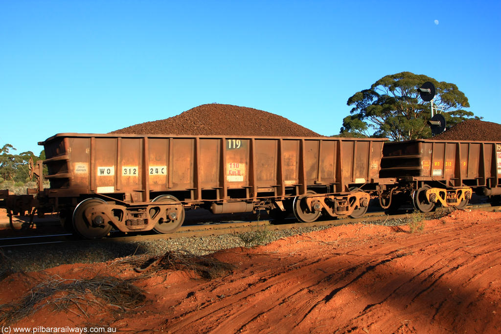 100731 02353
WO type iron ore waggon WO 31224 is one of a batch of eighty six built by WAGR Midland Workshops between 1967 and March 1968 with fleet number 119 for Koolyanobbing iron ore operations, with a 75 ton and 1018 ft³ capacity, on loaded train 6413 at Binduli Triangle, 31st July 2010. This unit was converted to WOC for coal in 1986 till 1994 when it was re-classed back to WO.
Keywords: WO-type;WO31224;WAGR-Midland-WS;