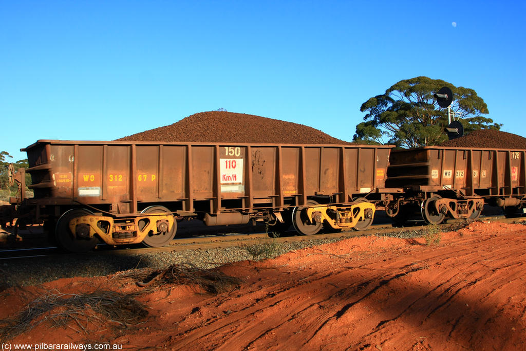 100731 02354
WO type iron ore waggon WO 31267 is one of a batch of eighty six built by WAGR Midland Workshops between 1967 and March 1968 with fleet number 150 for Koolyanobbing iron ore operations, with a 75 ton and 1018 ft³ capacity, on loaded train 6413 at Binduli Triangle, 31st July 2010. This unit was converted to WOC for coal in 1986 till 1994 when it was re-classed back to WO.
Keywords: WO-type;WO31267;WAGR-Midland-WS;