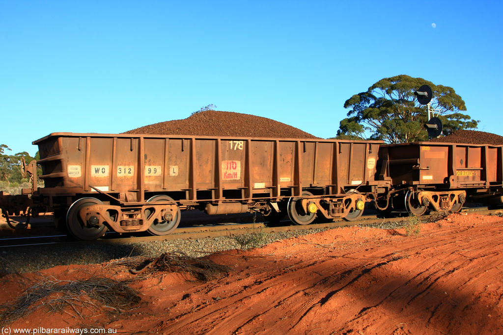 100731 02355
WO type iron ore waggon WO 31299 is one of a batch of fifteen built by WAGR Midland Workshops between July and October 1968 with fleet number 178 for Koolyanobbing iron ore operations, with a 75 ton and 1018 ft³ capacity, on loaded train 6413 at Binduli Triangle, 31st July 2010. This unit was converted to WOS superphosphate in the late 1980s till 1994 when it was re-classed back to WO.
Keywords: WO-type;WO31299;WAGR-Midland-WS;WOS-type;