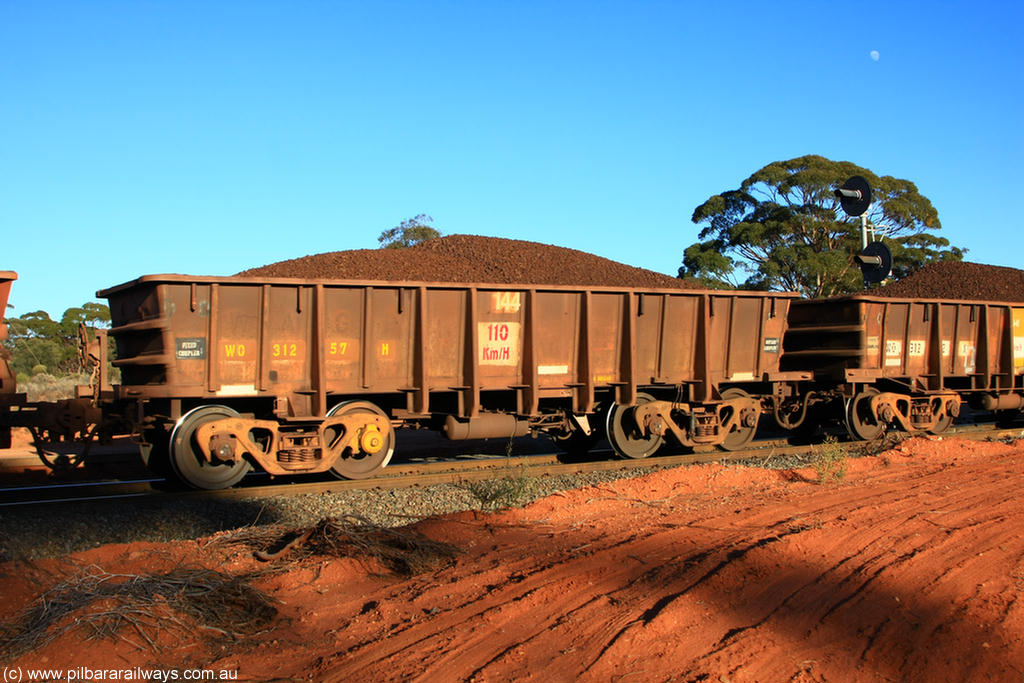 100731 02357
WO type iron ore waggon WO 31257 is one of a batch of eighty six built by WAGR Midland Workshops between 1967 and March 1968 with fleet number 144 for Koolyanobbing iron ore operations, with a 75 ton and 1018 ft³ capacity, on loaded train 6413 at Binduli Triangle, 31st July 2010.
Keywords: WO-type;WO31257;WAGR-Midland-WS;
