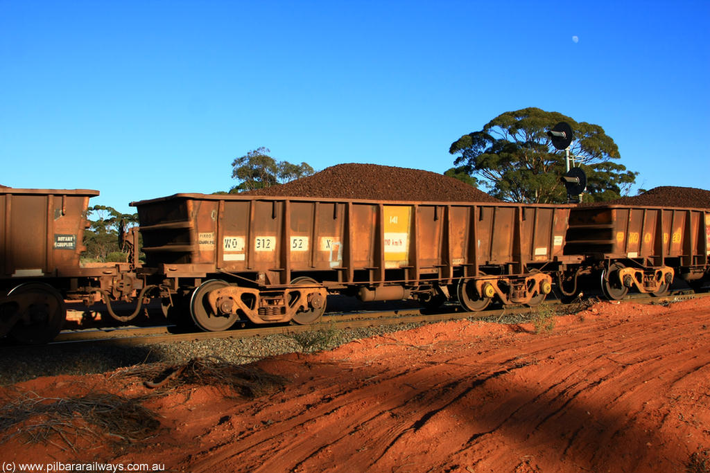 100731 02358
WO type iron ore waggon WO 31252 is one of a batch of eighty six built by WAGR Midland Workshops between 1967 and March 1968 with fleet number 141 for Koolyanobbing iron ore operations, with a 75 ton and 1018 ft³ capacity, on loaded train 6413 at Binduli Triangle, 31st July 2010.
Keywords: WO-type;WO31252;WAGR-Midland-WS;