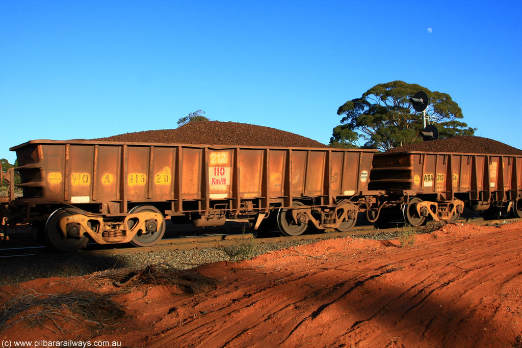 100731 02359
WOA type iron ore waggon WOA 31329 is one of a batch of thirty nine built by WAGR Midland Workshops between 1970 and 1971 with fleet number 212 for Koolyanobbing iron ore operations, with a 75 ton and 1018 ft³ capacity, on loaded train 6413 at Binduli Triangle, 31st July 2010.
Keywords: WOA-type;WOA31329;WAGR-Midland-WS;