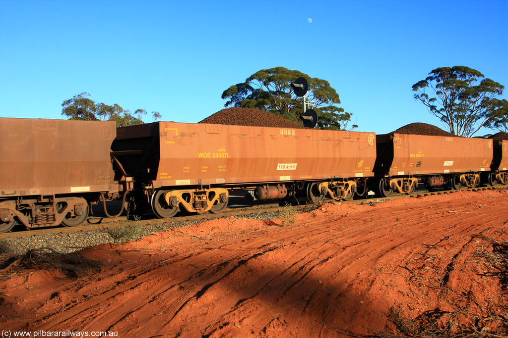 100731 02372
WOE type iron ore waggon WOE 33497 is one of a batch of one hundred and twenty eight built by United Group Rail WA between August 2008 and March 2009 with serial number 950211-037 and fleet number 8982 for Koolyanobbing iron ore operations, on loaded train 6413 at Binduli Triangle, 31st July 2010.
Keywords: WOE-type;WOE33497;United-Group-Rail-WA;950211-037;