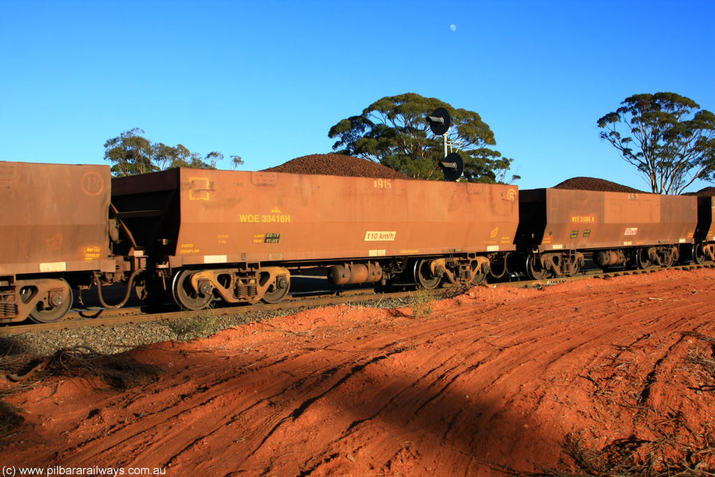 100731 02377
WOE type iron ore waggon WOE 33416 is one of a batch of one hundred and forty one built by United Group Rail WA between November 2005 and April 2006 with serial number 950142-121 and fleet number 8915 for Koolyanobbing iron ore operations, on loaded train 6413 at Binduli Triangle, 31st July 2010.
Keywords: WOE-type;WOE33416;United-Group-Rail-WA;950142-121;